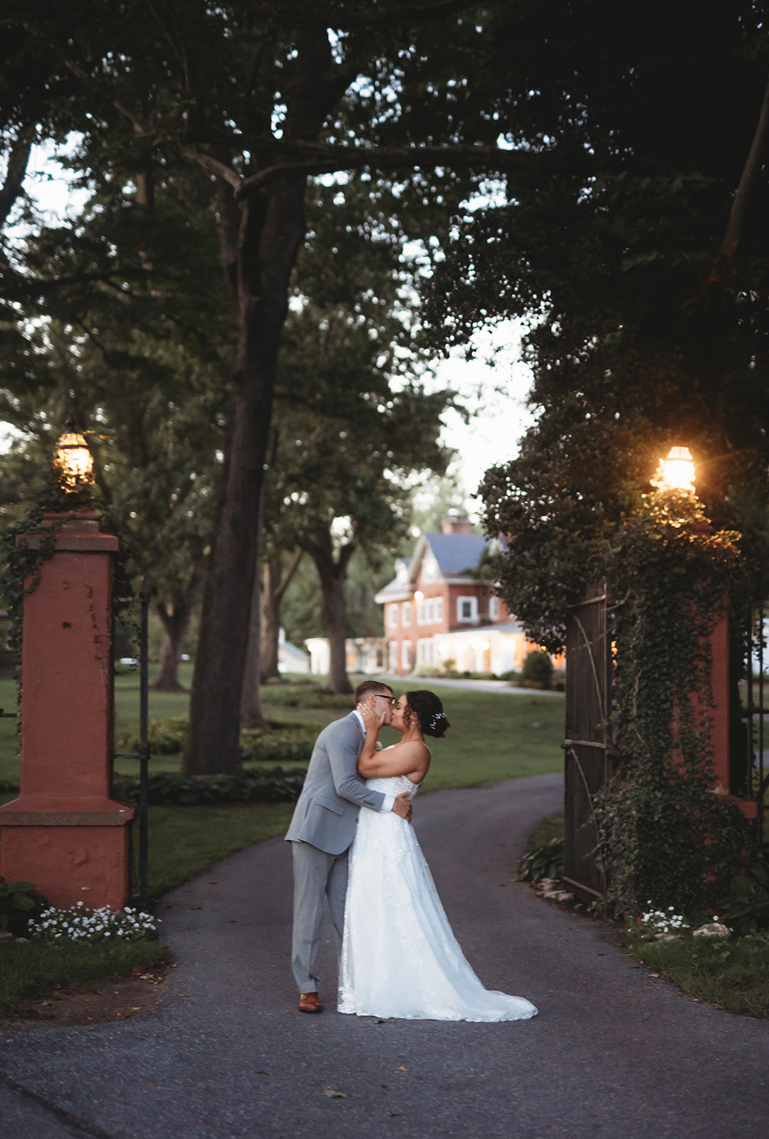 Newlyweds embrace at Cameron Estate Inn